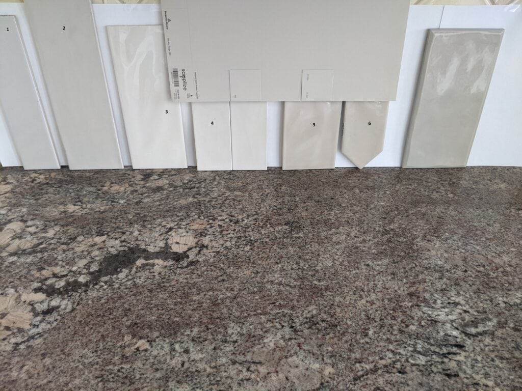 pink, rose toned granite countertop, 2000s coordinating with a new subway tile backsplash