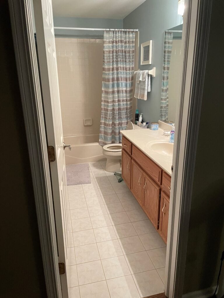 1990 bathroom before update, wood oak vanity, tile floor, taupe tub surround (3)
