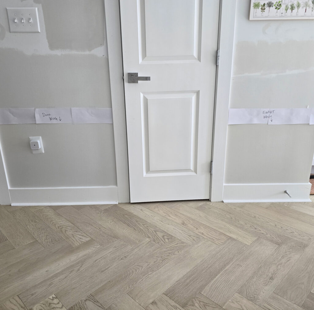Benjamin Moore Dove Wing, Behr ULtra Pure White trim, Sherwin Williams Egret White, warm off-whites, herringbone white washed wood floor with gray taupe pink tones