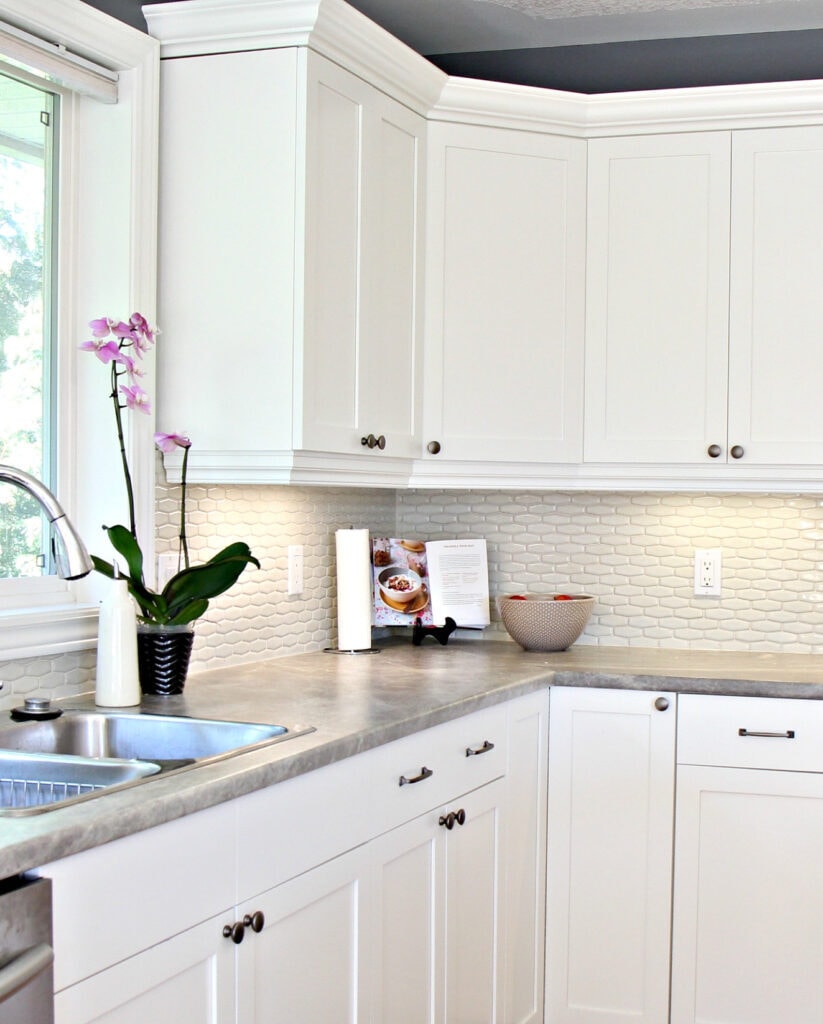 Maple cabinets painted Cloud White, Gray paint colour, quartz, hexagon subway tile cream backsplash and soapstone formica countertops