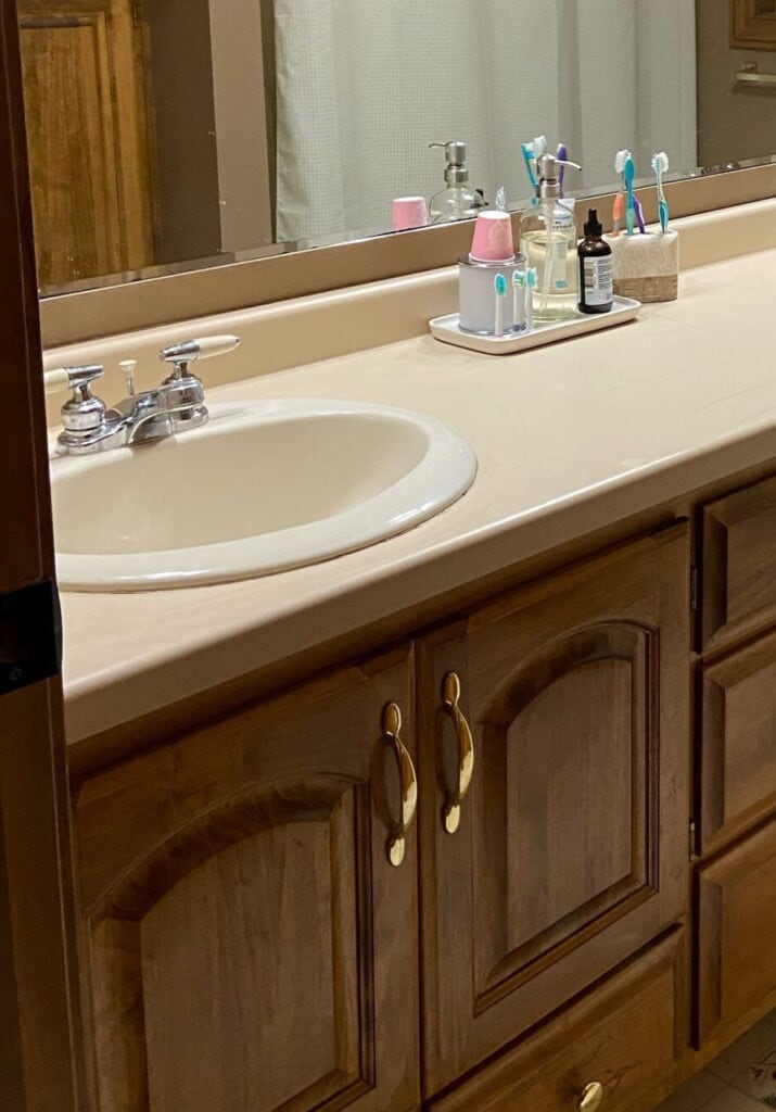 almond or bone bathroom fixtures, vinyl floor, maple dark wood vanity, brass gold hardware, 1990 (2)