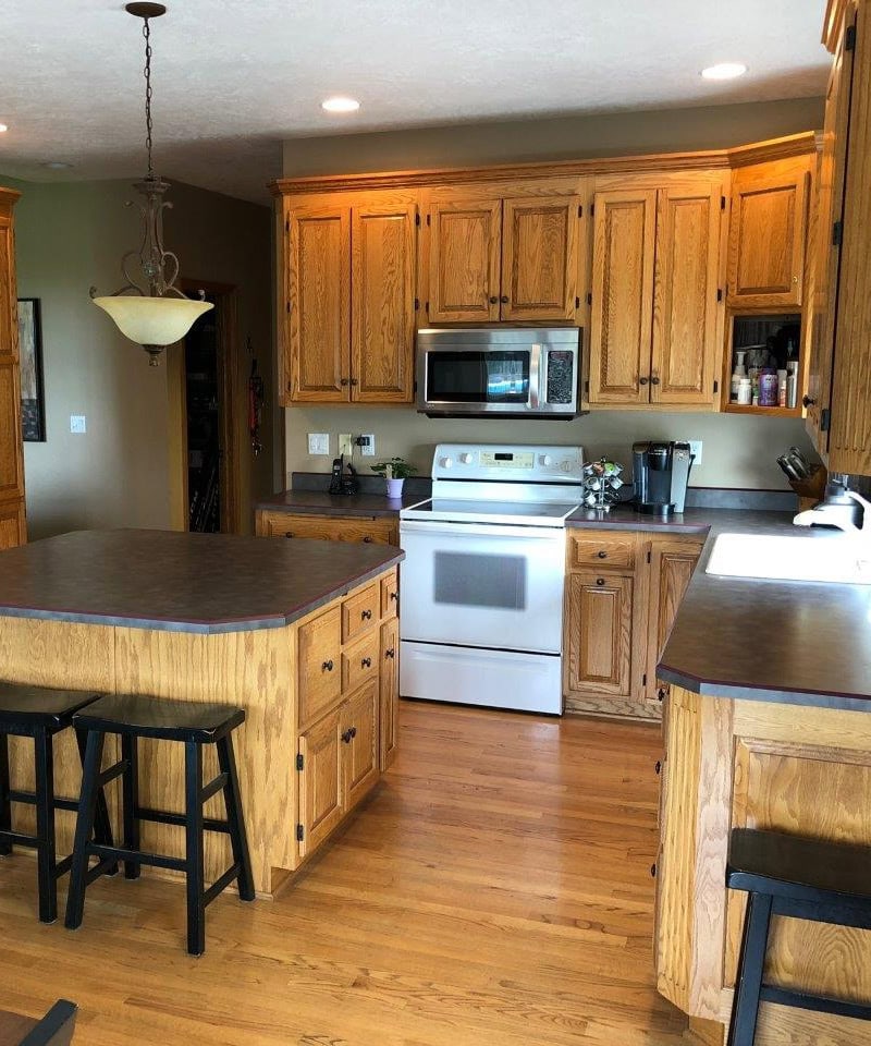 oak kitchen wood cabinets before kylie m, island, laminate counters, white appliances, oak floor
