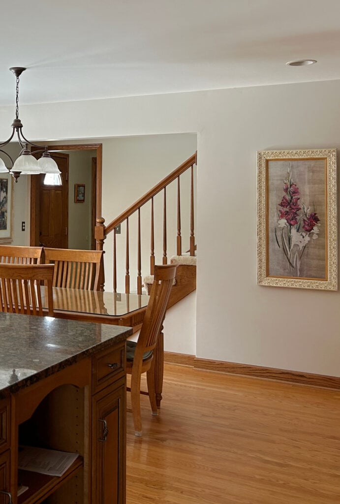 Balboa Mist, kitchen with granite countertops, oak floor, wood maple cabinets, oak window trim, stair railing. (1)