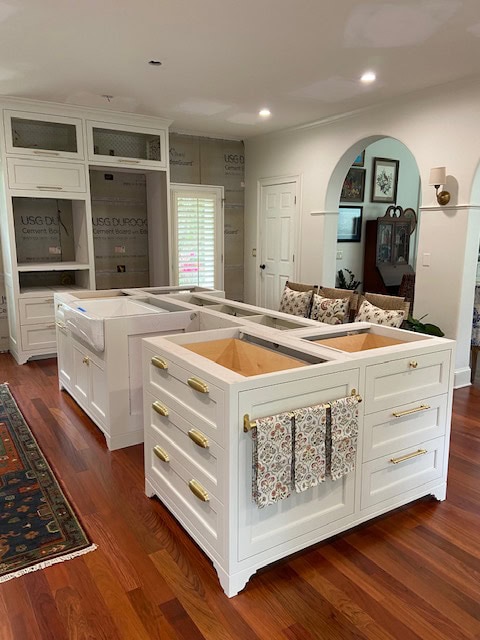 Benjamin Moore China White, best warm off-white paint color, darkened, on painted kitchen cabinets, gold hardware, red exotic wood flooring (1)