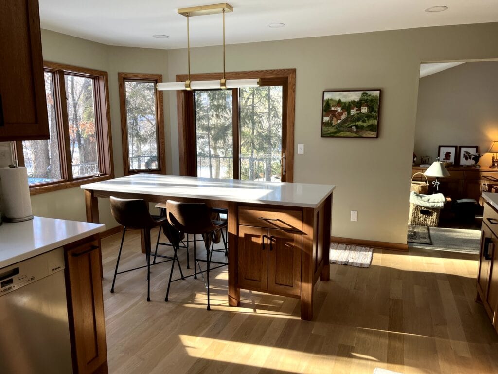 Benjamin Moore Paris Rain, oak wood trim, oak floors, oak island kitchen cabinets. Best paint colors update ideas