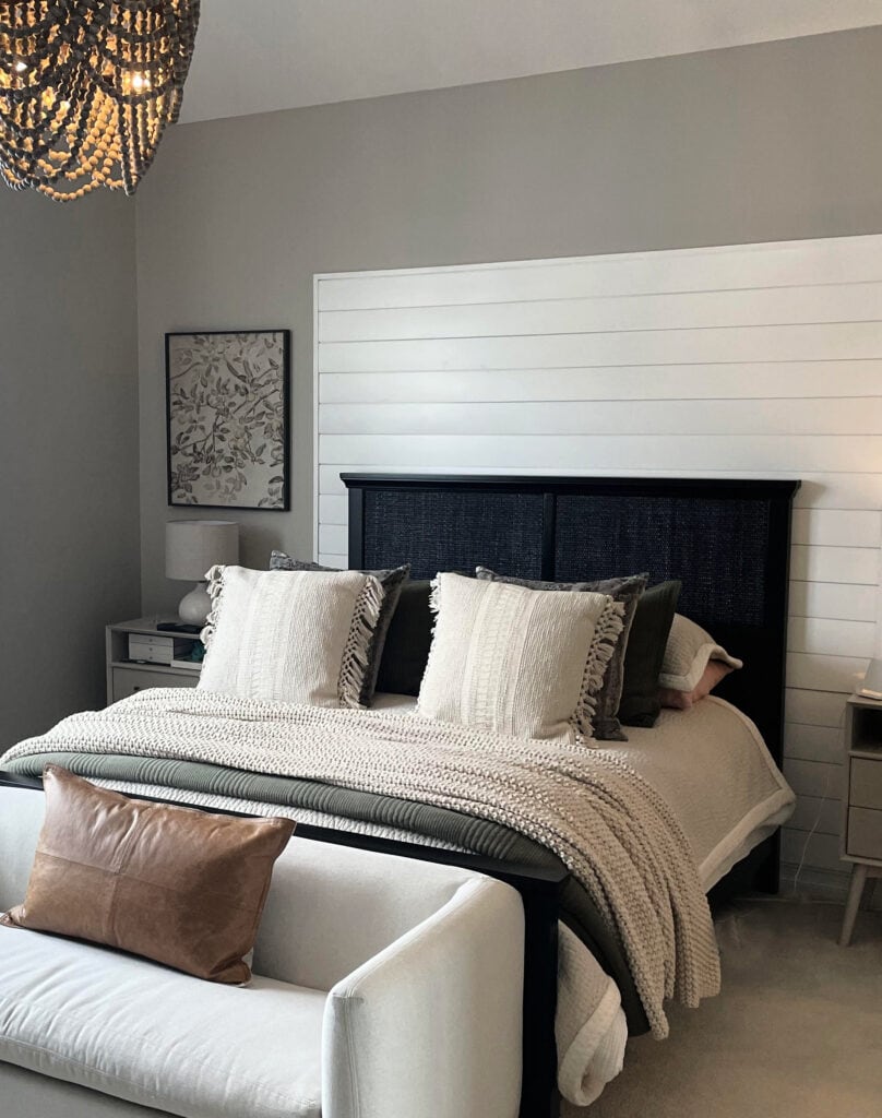 Benjamin Moore Revere Pewter, shiplap, beige taupe carpet, sofa at end of bed, Kylie M online paitn color expert client bedroom photo. Neutral boho linens and home decor (1)