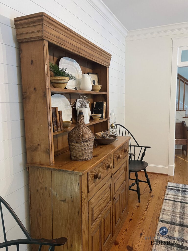 Benjamin Moore White Dove horizontal shiplap accent wall in dining room, pine wood floors, pine buffet and hutche, white trinm and ceilings. Kylie M, online expert paint color consulting