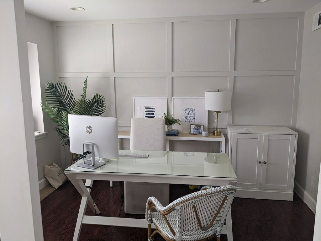 Benjamin Moore classic Gray in home office with grid accent wall, white desk red-violet toned wood floorin