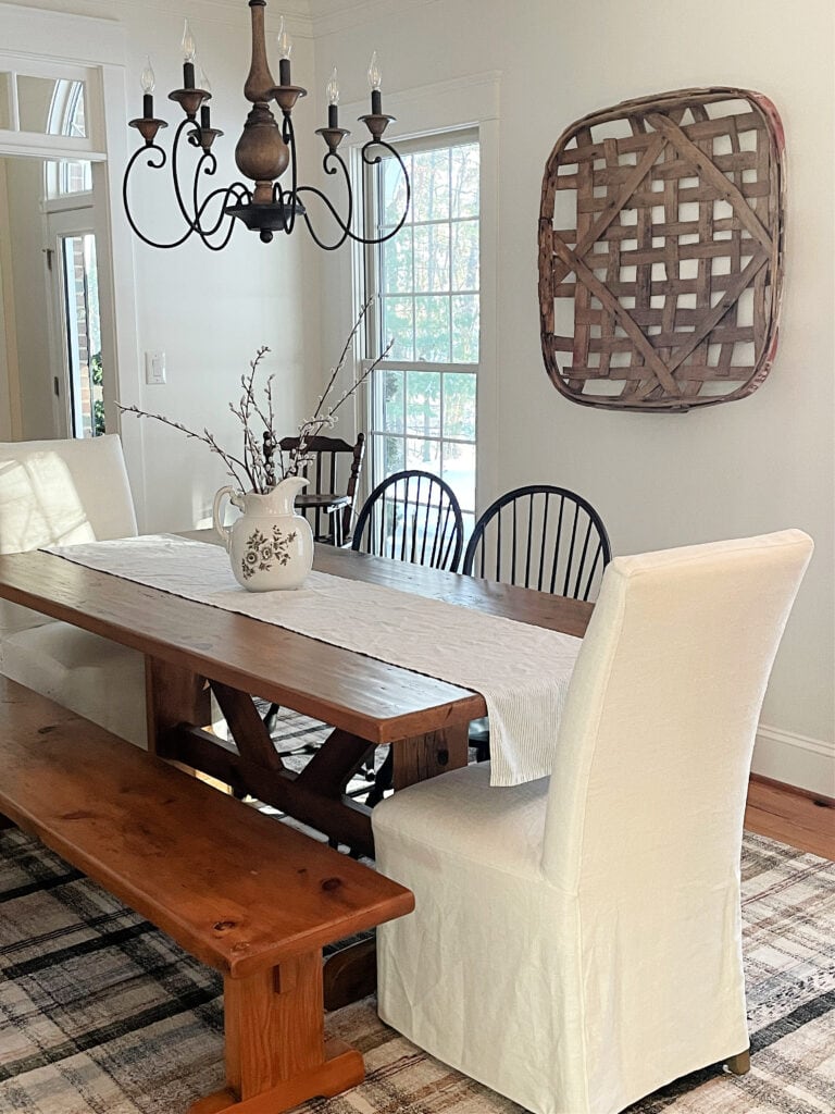 Dining room painted trim, walls, ceiling, Benjamin Moore White Dove, east facing exposure, modern farmhouse light, furniture, decor. Kylie M Interiors Edesign. Pine wood