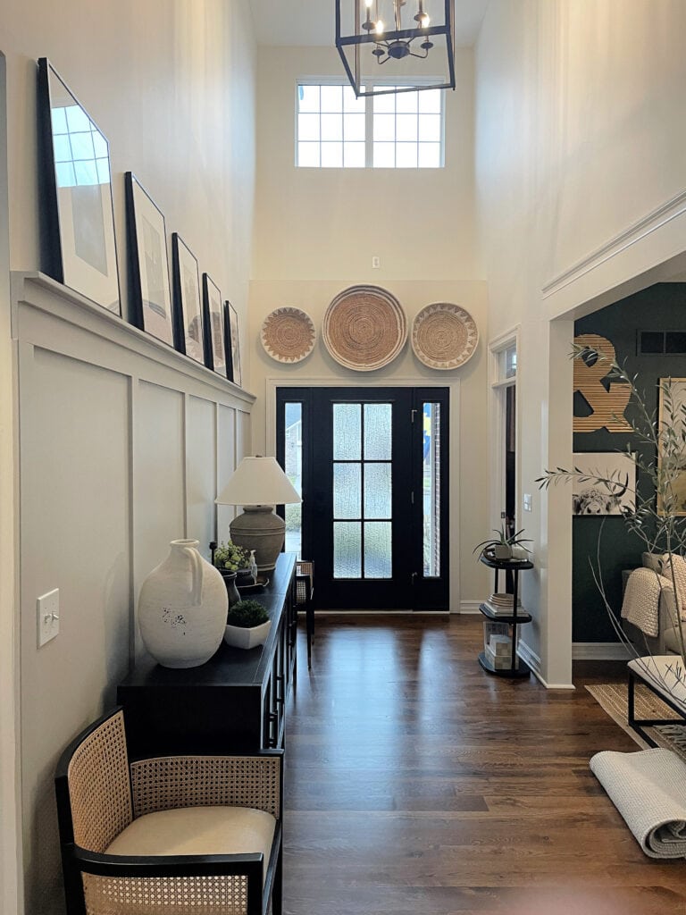 Entryway, board and batten, dark brown oak floor, black front door, side lights, hoem decor, Revere Pewter and Benjamin Moore Chamois, White Dove