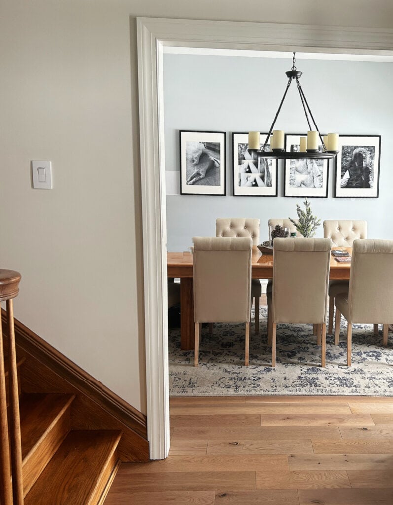 Sherwin Williams North Star blue gray in dining room, Pearly White in entryway with wood floor. (1)