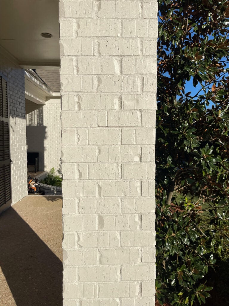 BEnjamin Moore China White on painted exterior brick, warm off-white paint color