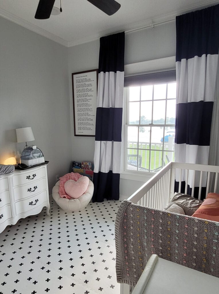 Baby nursery boy or girls room, click together foam white and cross floor, Sherwin Williams Rock Candy cool gray paint color on walls, white trim, drapes