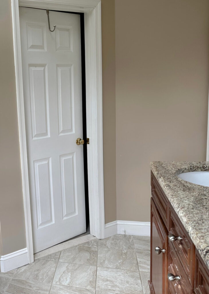Behr Mushroom Bisque popular beige paint color in bathroom, beige tile floor, beige granite countertop, maple orange vanity,