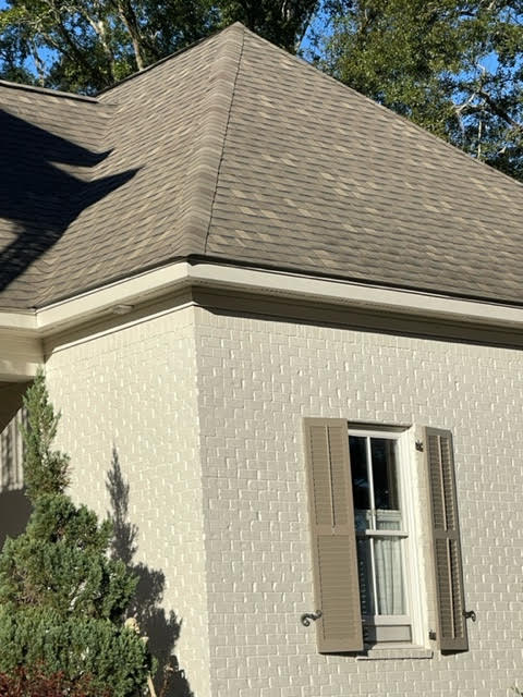 Benjamin Moore China White on painted exterior brick, Sherwin Williams Keystone Gray shutters, asphalt roof