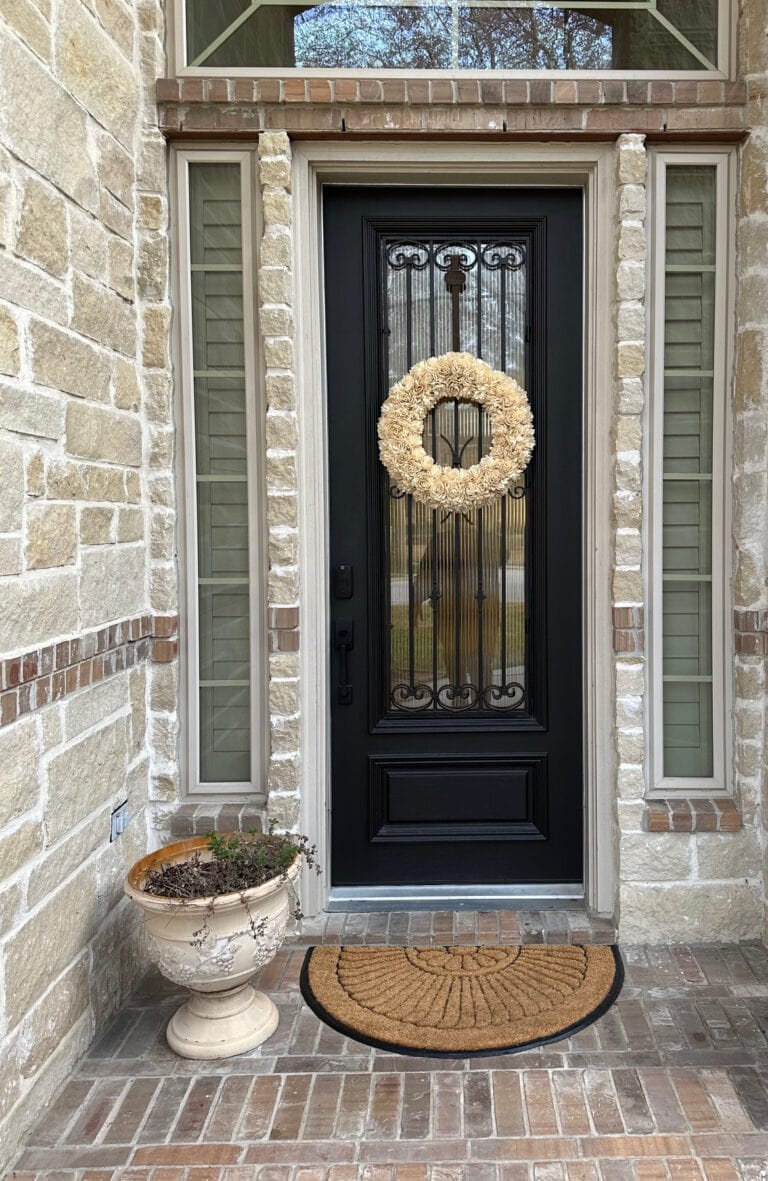 Benjamin Moore Onyx black painted front door, exterior stone and brick