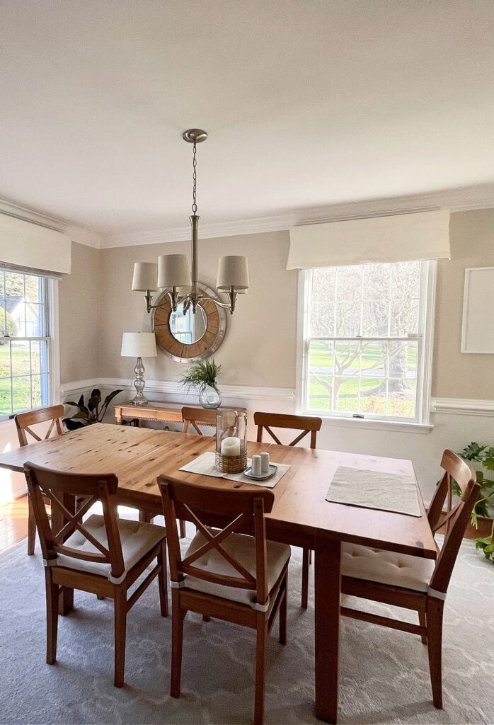Benjamin Moore White Sand with Chantilly Lace lower walls and trim. WArm neutral, counter dining room with pink-toned wood floor.