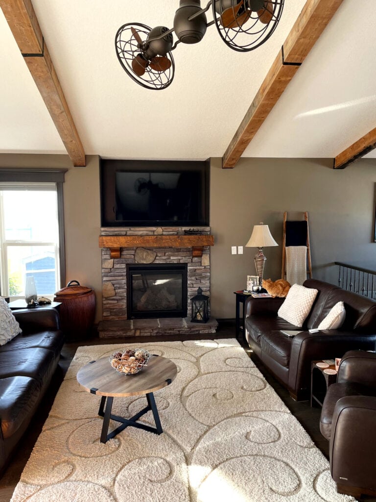 Benjamin Moore Willow and Barnboard, stone fireplace, dark taupe, brown, beige, leather furniture. wood beams.