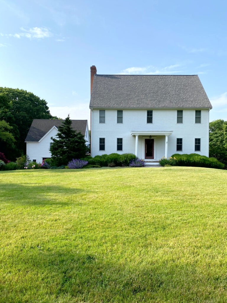Farmhouse white siding exterior taupe warm gray asphalt roof, Arborcoat white 64001 solid stain, Hodley Red burgundy front door