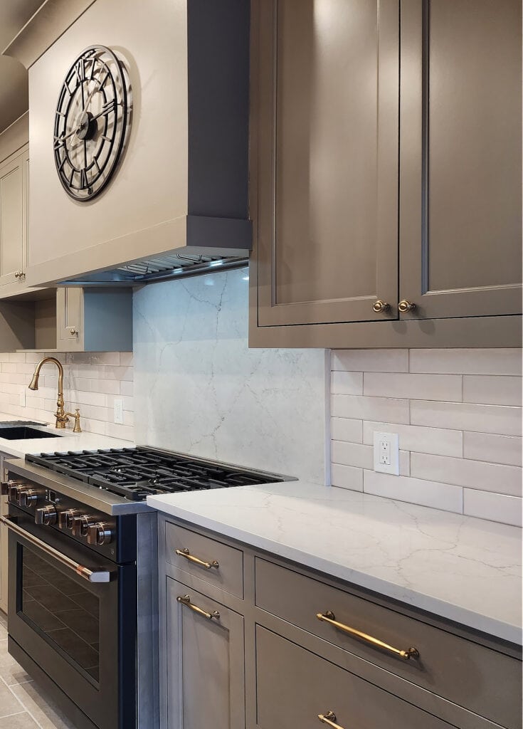 GE Cafe matte black appliances, stove oven, gold hardware, white quartz countertop, subway tile, greige taupe painted cabinets, Kylie M INteriors