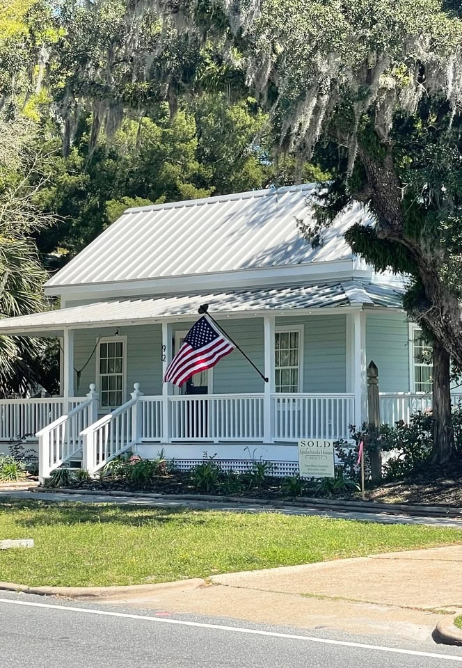 Gray painted exterior with gray, silver metal roof, white trim and front porch, Benjamin Moore White OC 151