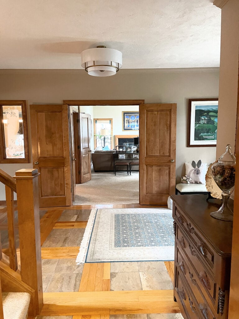 omadic Desert, entryway, beige taupe tile floor, wood pattern, wood trim and doors, beige carpet, Sherwin Williams, Kylie M.