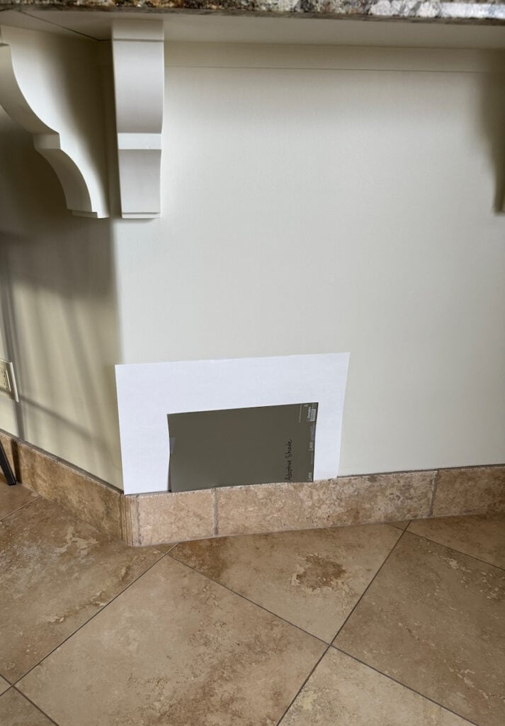 Sherwin Williams Adaptive Shade dark greige green accent with granite countertop and travertine tile floor