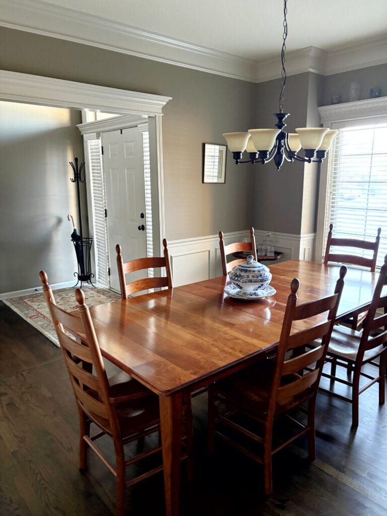 Sherwin Williams Moth Wing beige greige painted walls, Accessible Beige trim and wainscoting, crown molding, dining room