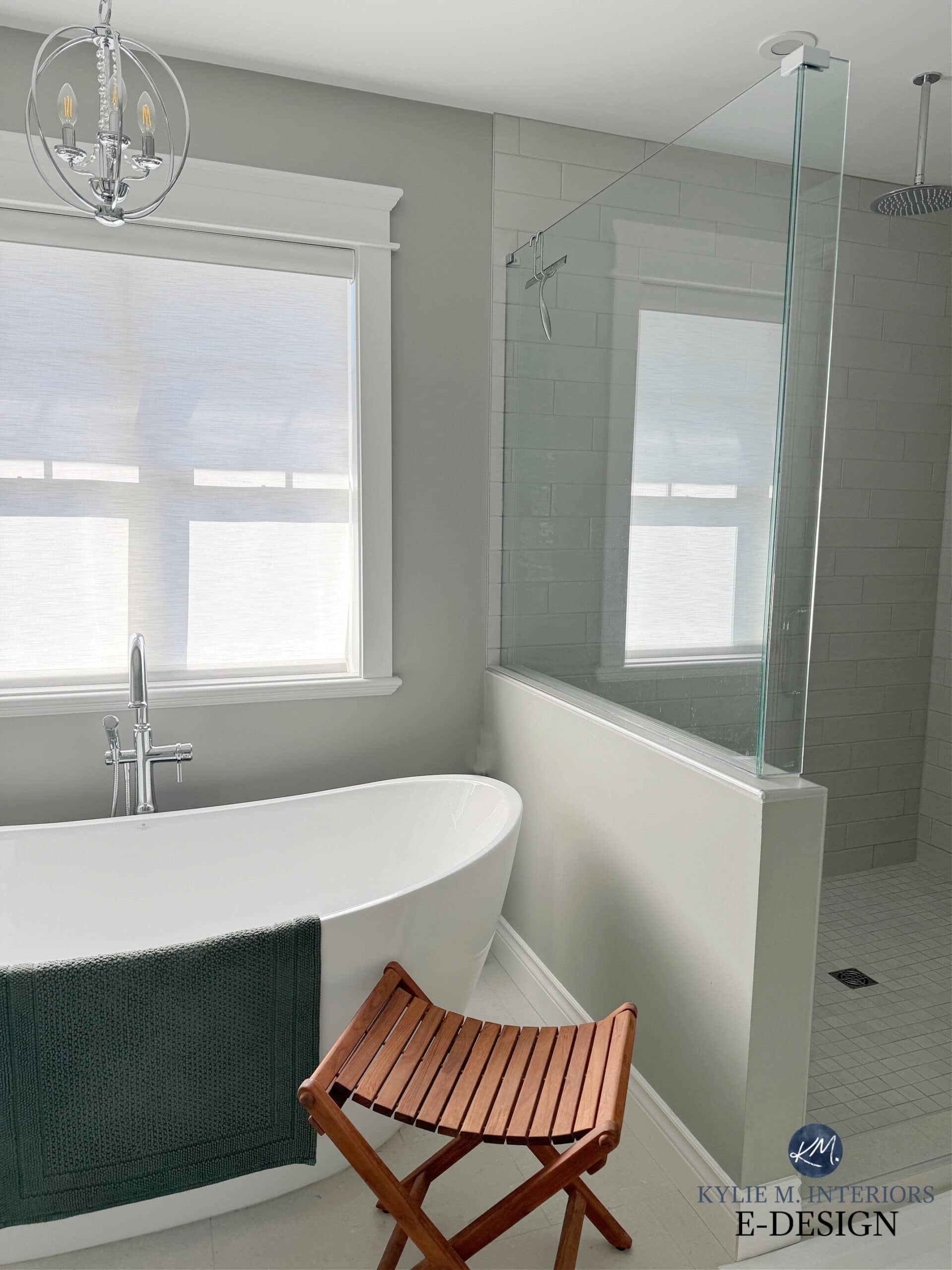 Sherwin Williams Sensible Hue green gray paint color, freestanding bathtub in bathroom, walk in shower, half glass wall and door, tile floor, chrome fixtures, Kylie M