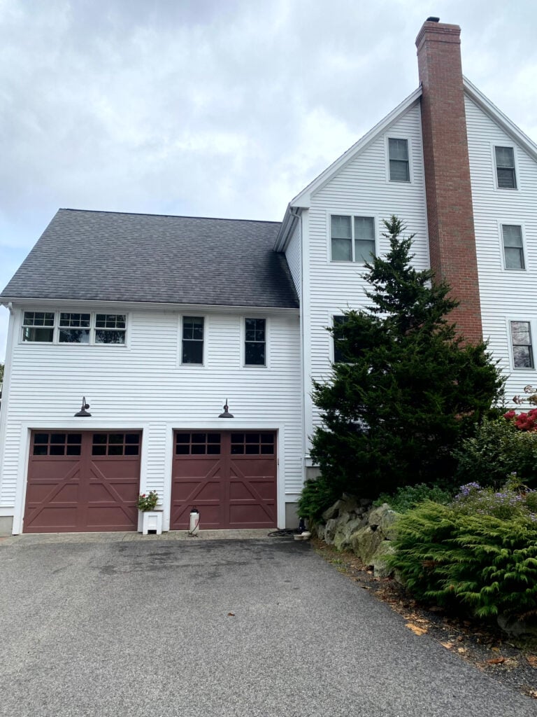 burgundy red garage doors with brick chimney, BEnjamin Moore Hodly Red, Arborcoat solid white stain 64001 white siding, farmhouse