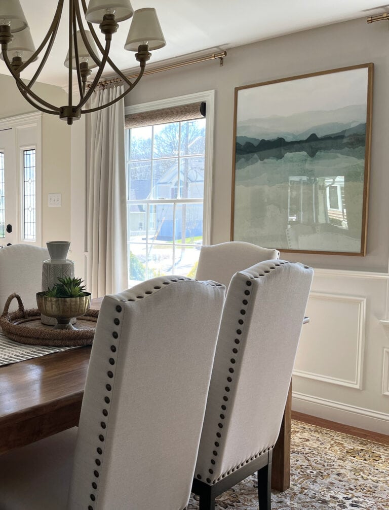 dining room with Benjamin Moore White Dove ceiling, trim, and wainscoting. Sherwin Williams Worldly Gray greige paint color on walls, home decor, transitional