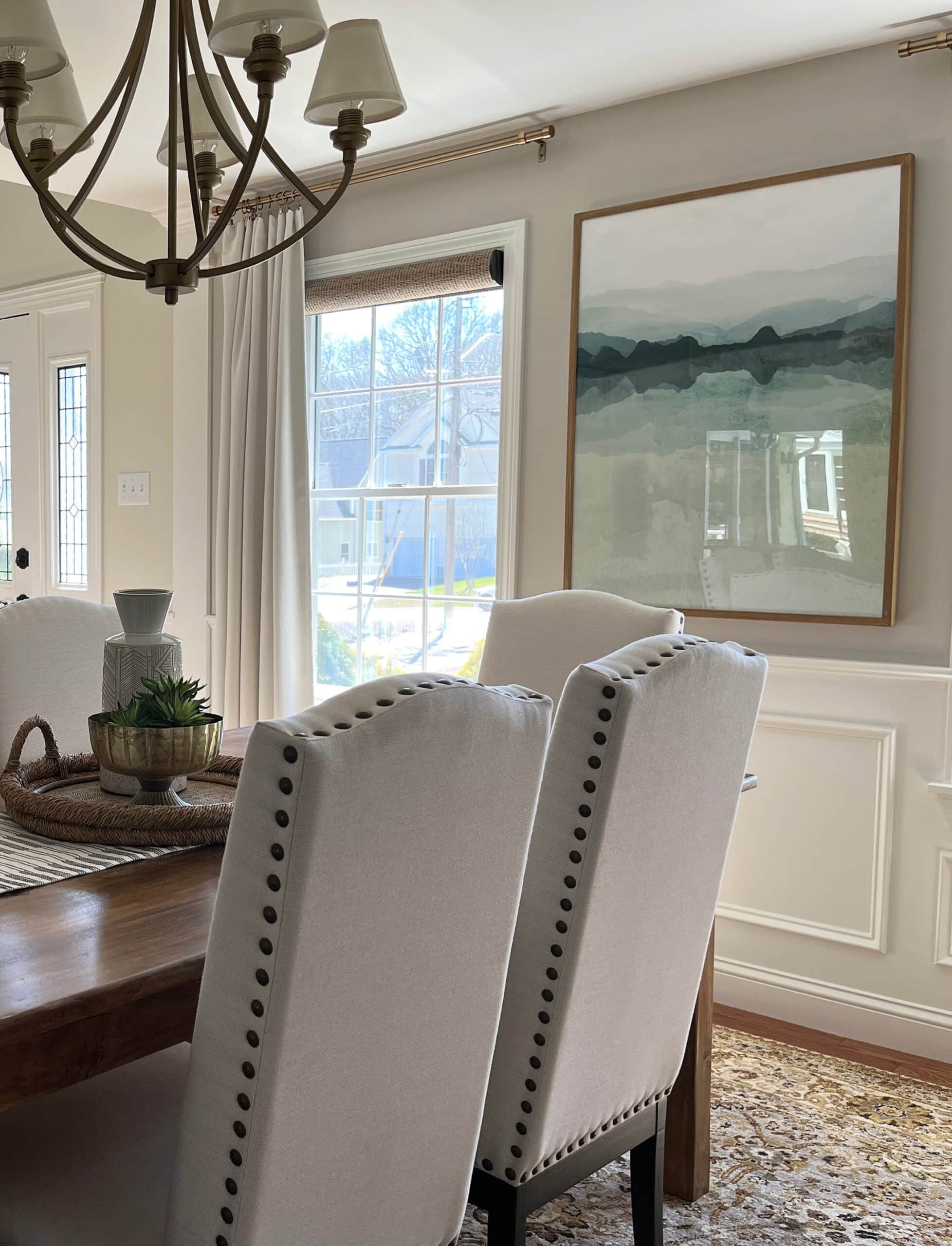 dining room with Benjamin Moore White Dove ceiling, trim, and wainscoting. Sherwin Williams Worldly Gray greige paint color on walls, home decor, transitional