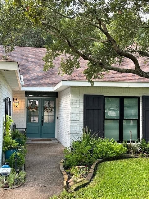 exterior brick painted Romabio Avorio White, Sherwin Williams Iron Ore shutters, black windows, Riverway teal front door, asphalt roof