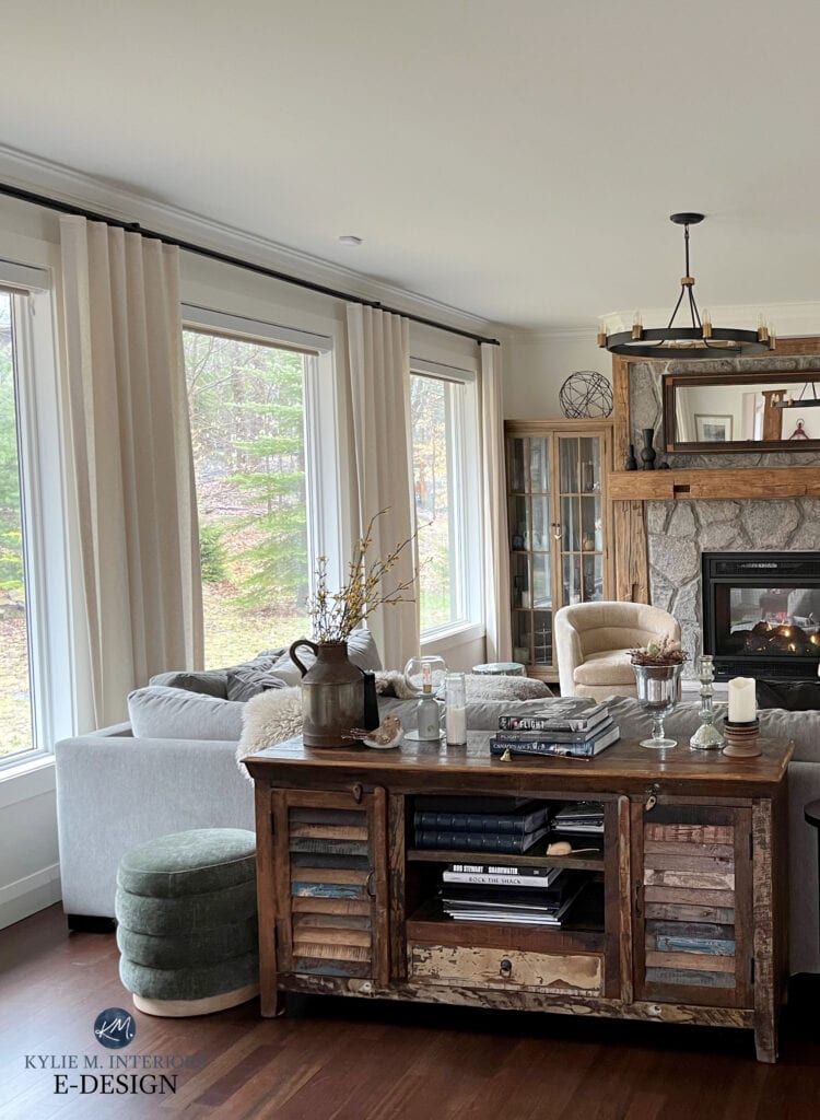 living room, family room, dark wood flooring, stone fireplace, wood mantel rustic, Benjamin MOore White Dove color drench on walls, trims, ceiling, tub chairs, drapes, sectional (1)