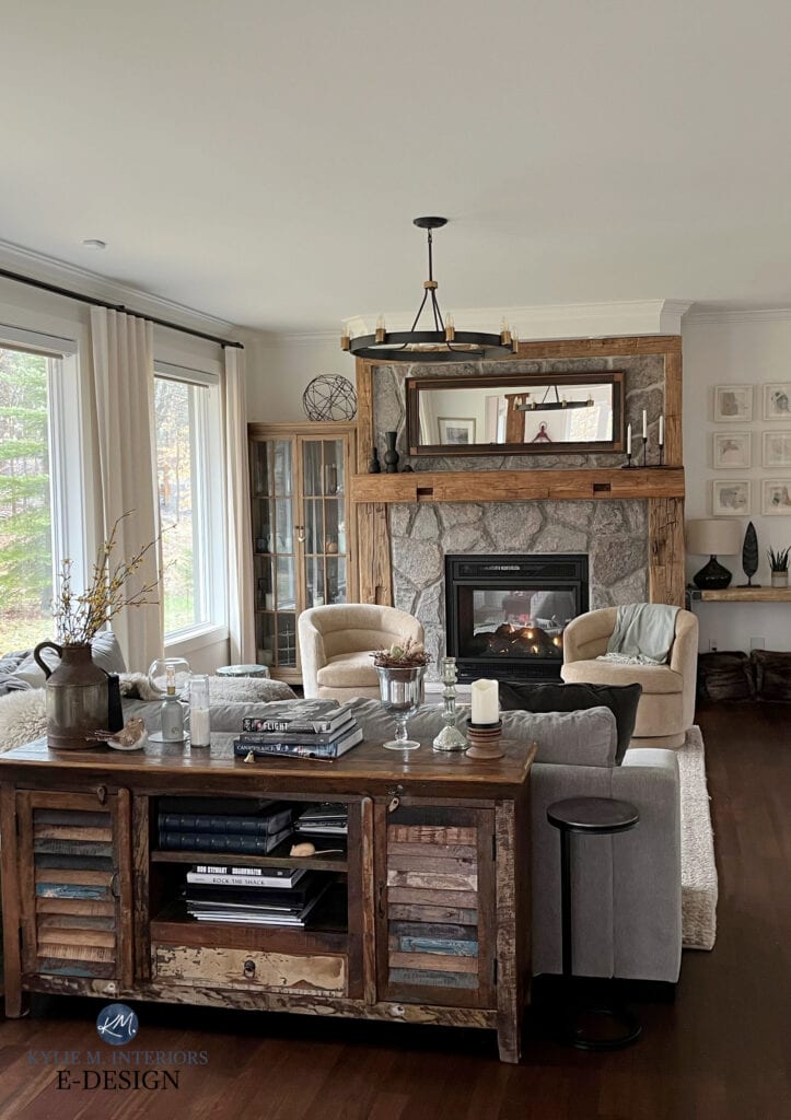 living room, family room, dark wood flooring, stone fireplace, wood mantel rustic, Benjamin MOore White Dove color drench on walls, trims, ceiling, tub chairs, drapes, sectional (2)