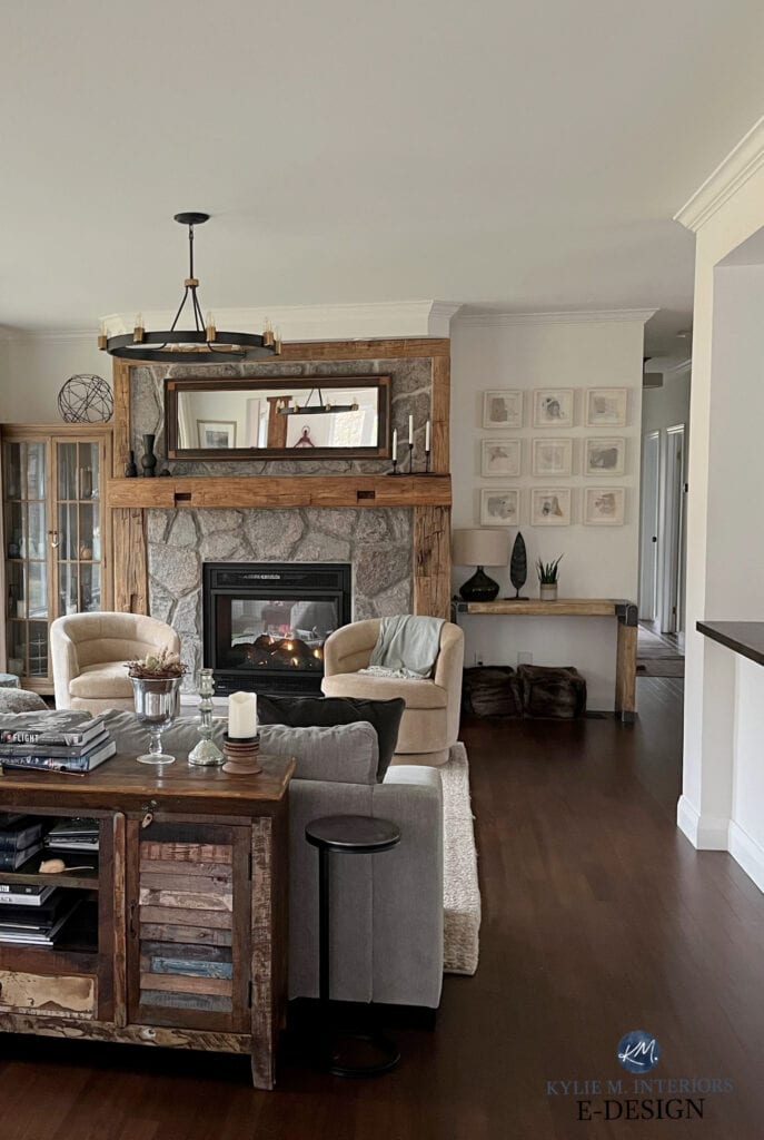 living room, family room, dark wood flooring, stone fireplace, wood mantel rustic, Benjamin MOore White Dove color drench on walls, trims, ceiling, tub chairs, drapes, sectional (3)