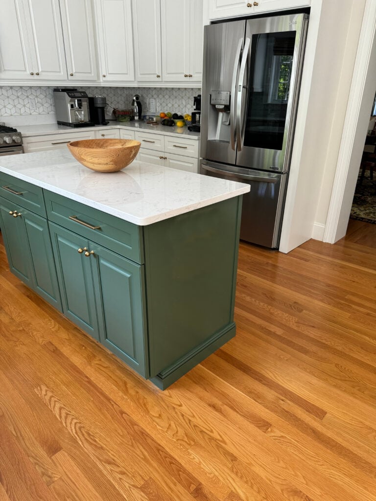 Benjamin Moore Peale Green painted kitchen island cabinet, gold hardware, golden oak floor, Benjamin Moore White dove cabinets, quartz countertop