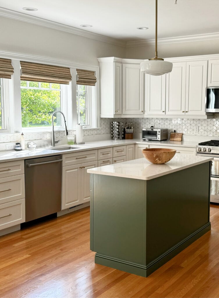 Benjamin Moore White Dove painted kitchen cabinets, golden oak floor, green island, Peale Green, soft white quartz countertop, Cambria, marble backsplash, Sherwin Williams Pearly White walls,