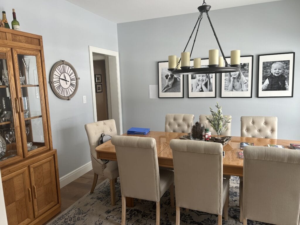 Sherwin Williams North Star, best blue gray blend paint color in dining room with wood floor and furniture, off-white trim.