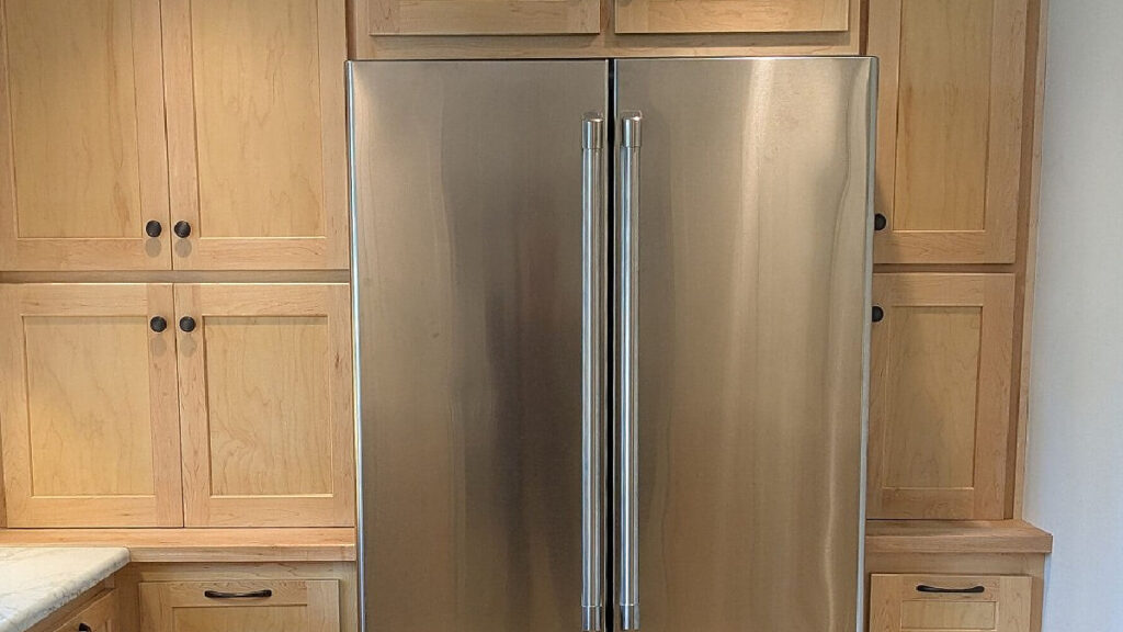 Hardware to update maple wood kitchen cabinets or cherry, black knobs, stainless steel fridge