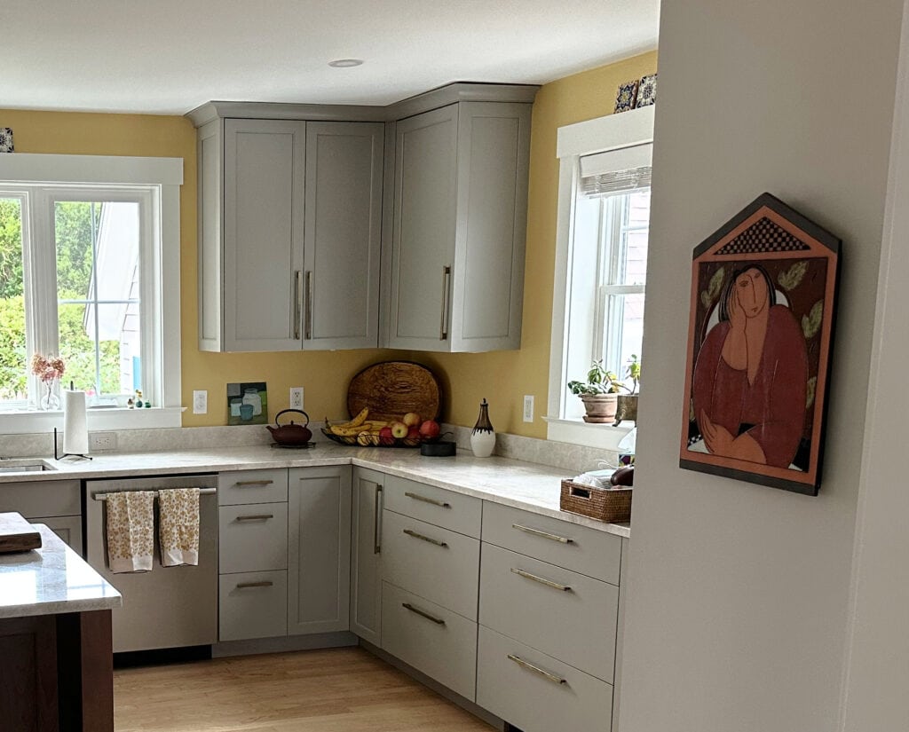 Benjamin Moore Da Vinci's Canvas yellow golden paint color on kitchen walls, Pavestone painted cabinets, Taj Mahal quartzite countertops or similar, red oak flooring and wood island