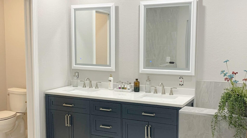 Benjamin Moore Nimbus in bathroom with navy blue vanity and marble look tile floor