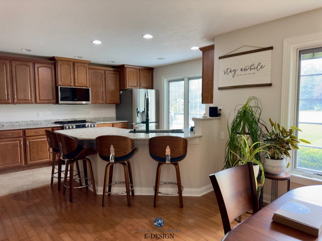 Kitchen with beige tile floor, granite countertop, maple or cherry, red stained wood cabinets and floor. Sherwin Williams Egret White paint color on walls