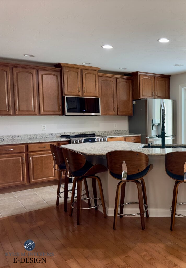 Sherwin Williams Egret White with cherry or maple red stained wood cabinets and floor, granite countertop, beige tile floor. Kylie M Edesign