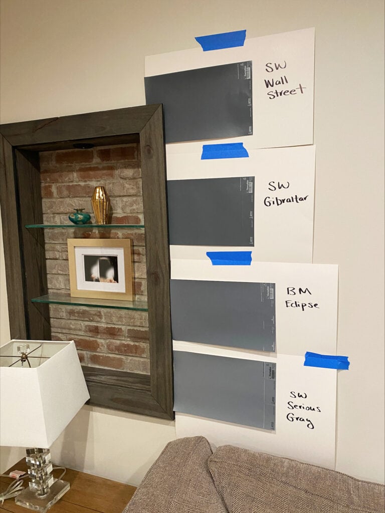 Aesthetic White walls. dark gray blue violet paint colors, accent or feature wall. Sherwin Williams Wall Street, Gibraltar, Serious Gray, Benjamin Moore Eclipse, brick accent