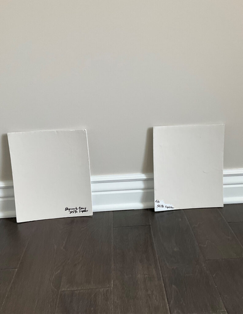 BEnjamin Moore Edgecomb Gray walls, Pure White trim, lightened 25 and 50 percent on sample boards, dark wood floor