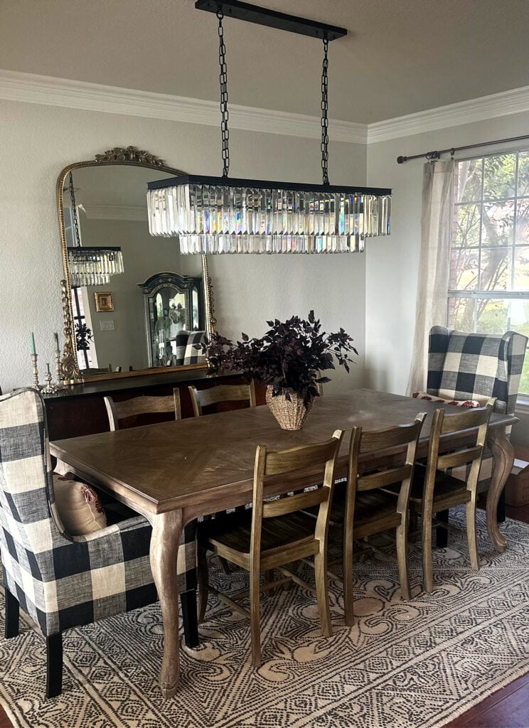 Sherwin Williams City Loft walls, Benjamin Moore chantilly Lace trim, modern farmhouse dining room, crystal chandelier, red darker wood floor