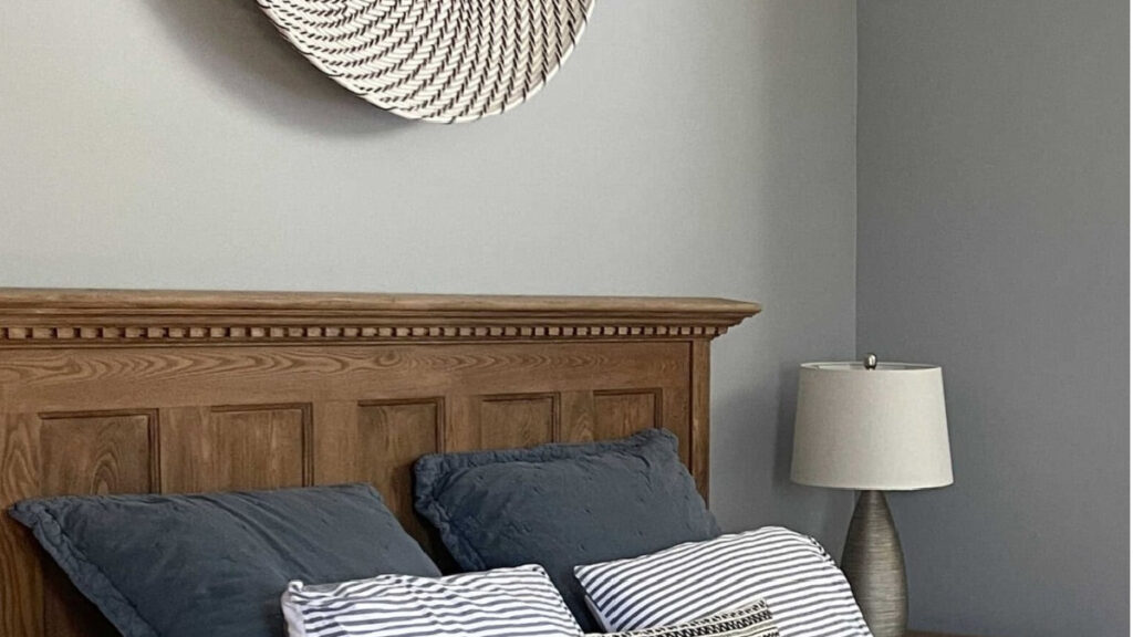 Benjamin Moore Coventry Gray in bedrom with wood headboard