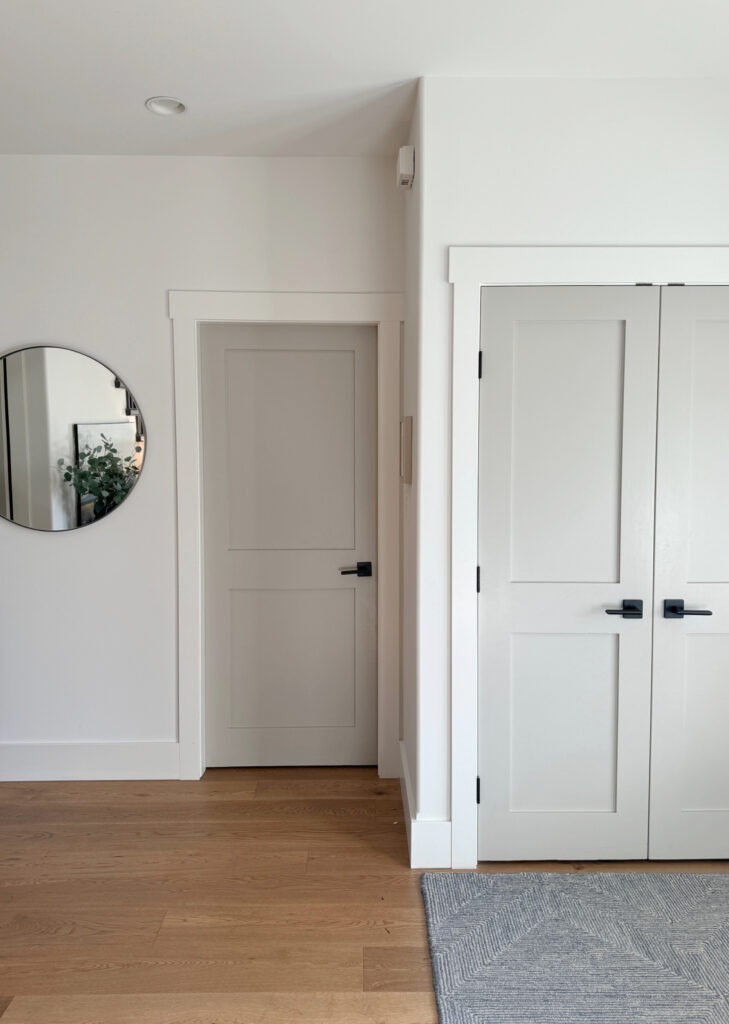 Benjamin Moore Revere Pewter darkened on interior doors, non-white trim and door idea. Oak wood floor, black hardware