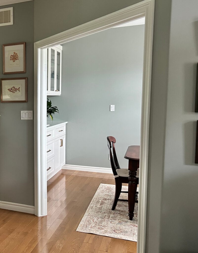 Bennamin Moore Gray Horse, oak floor, white trim, green-gray paint color